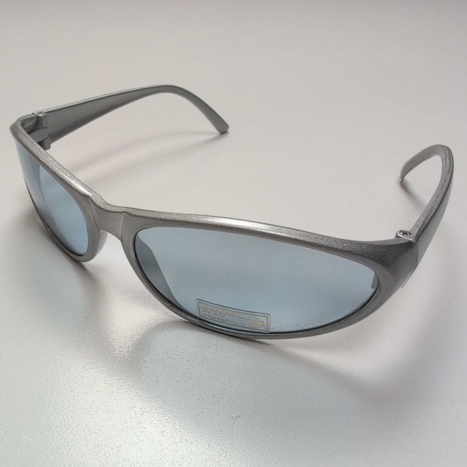 KAKIKO Lunettes de Soleil Ovales Gris Brillant Y2K Verres Légèrement Teintés