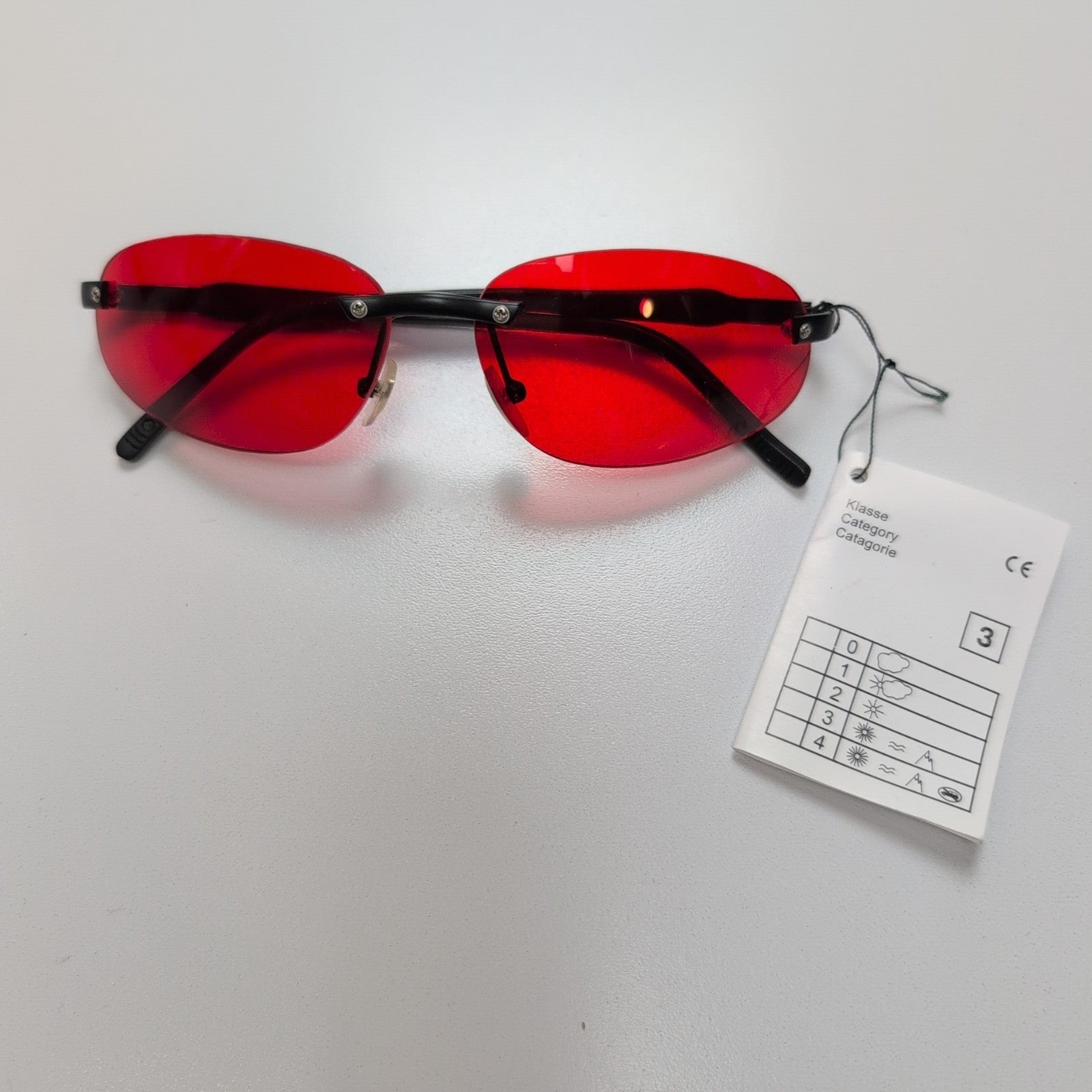 Lunettes de soleil Y2K Sans Monture Verres Ovales Teintés Rouge Branches Fines