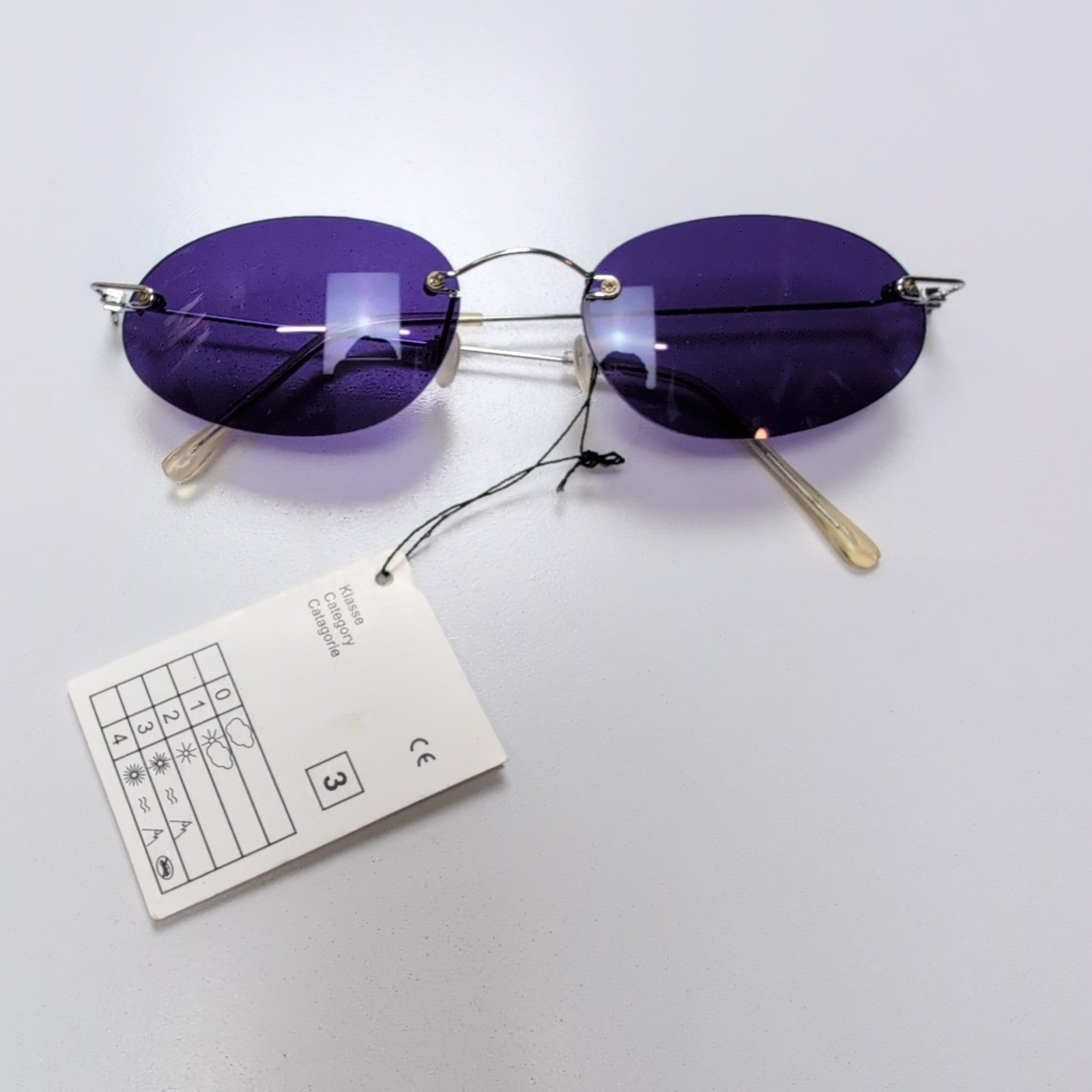 Lunettes de soleil Y2K Branche fine Métal chromé Sans monture Ovale Violet