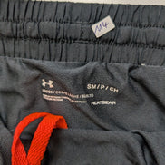 Short Under Armour HeatGear Noir & Orange Fluo - Femme Taille S